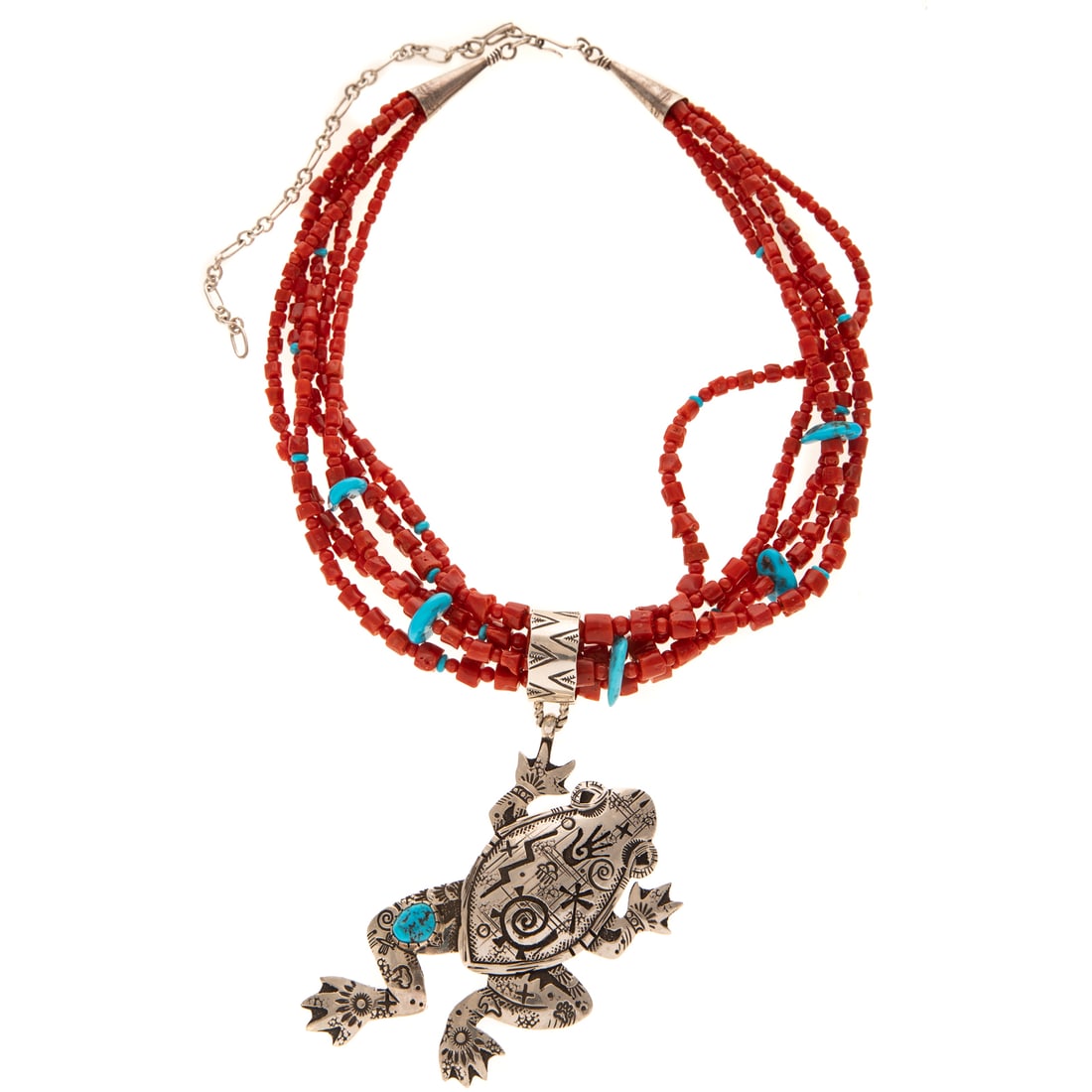 A Richard Singer Frog Pendant on Coral Necklace in Sterling Silver: Sterling silver frog pendant by Navajo designer Richard Singer (b. 1969), featuring traditional Navajo patterns and bezel set turquoise throughout frog, signed, 4 1/2 in. L, hanging on five strand cor