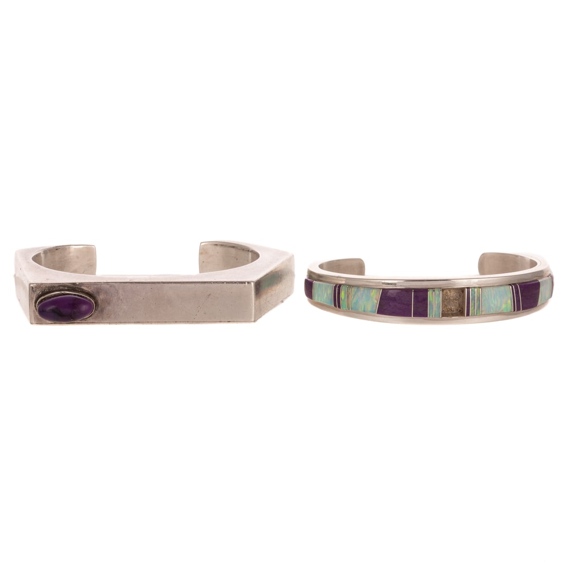 Two South Western Cuff Bracelets in Sterling Silver: 1) Sterling silver cuff bracelet by Navajo artist Chester Nez (b. 1921), featuring oval bezel set chariote, high polish faceted cuff, signed, 2 3/8 in. interior Diam., and 2) Sterling silver cuff by N
