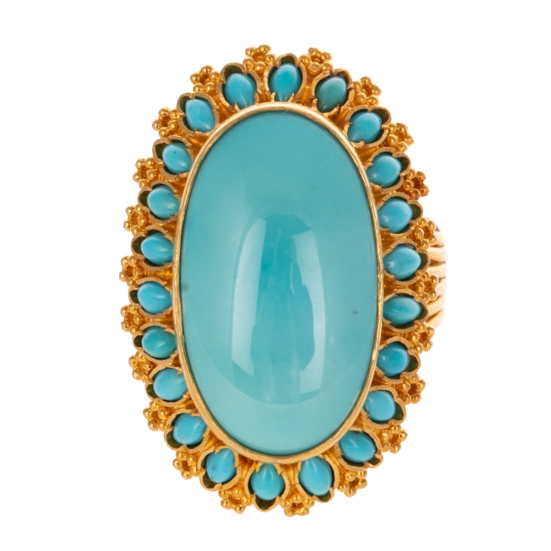 A Fine Turquoise Cocktail Ring in 18K: 18K yellow gold ring featuring a large elongated oval turquoise cabochon measuring 22 x 12 mm bezel set in the center of a marquise turquoise cabochon halo bezel set alternating with bead details, ope