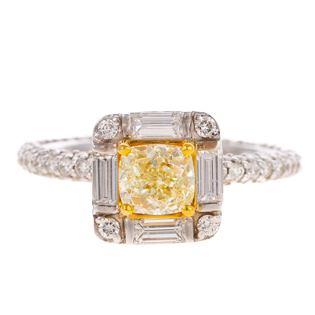 An Effy 0.80 ct Yellow Diamond Ring in 14K: 14K white gold ring by Effy featuring a cushion cut natural Fancy yellow diamond weighing approx. 0.80 ct with an average clarity grade of VS prong set in yellow gold in the center of a round and bagu