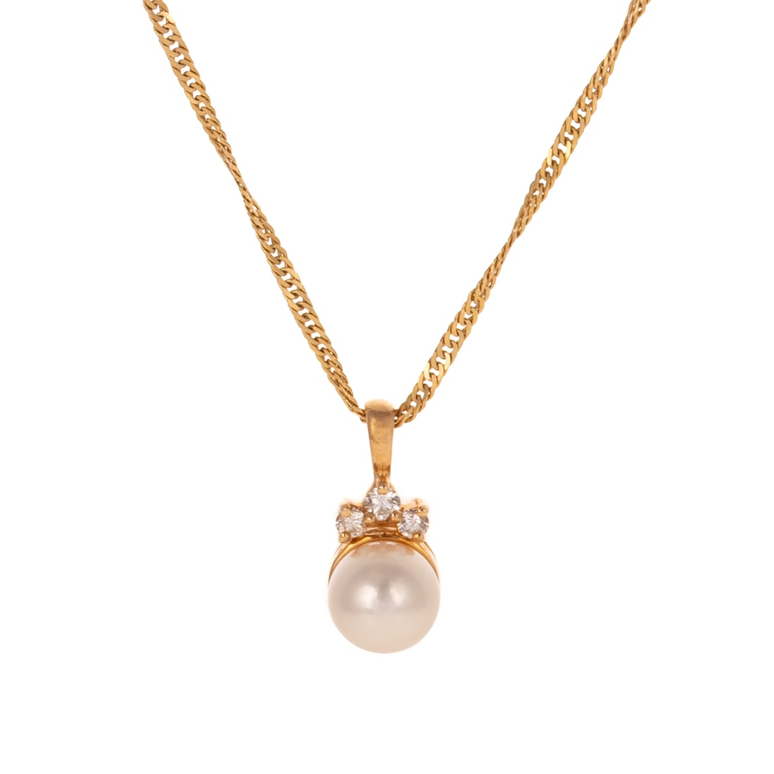 A Pearl & Diamond Pendant & Chain in 14K: 14K yellow gold pendant featuring a 7.4 mm cultured pearl with a trio of diamonds weighing approx. 0.06 ctw at the top of pendant, hanging on a 14K yellow gold twisted chain with spring ring clasp, 16