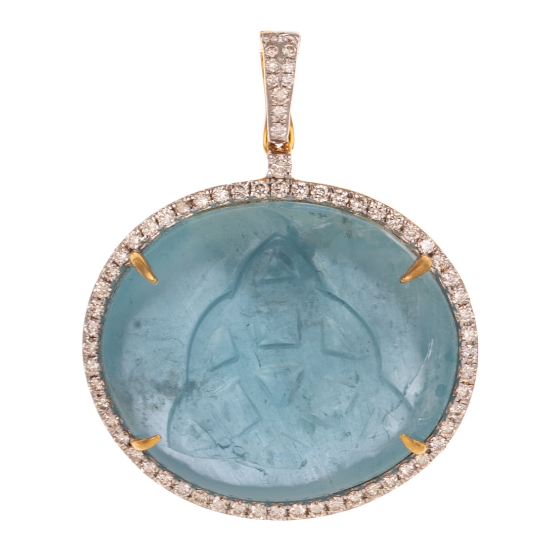 A Carved Aquamarine Pendant in 18K: 18K yellow gold pendant featuring a large oval aquamarine cabochon with a Celtic knot design carved into cabochon weighing approx. 53.40 carats prong set in the center of a halo of a round diamond