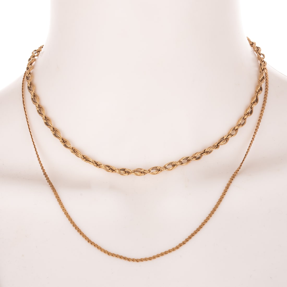 A Serpentine Chain & Rope Necklace in 14K: 1) 14K yellow gold choker length rope necklace, lobster clasp, 15 1/4 in. L, and 2) 14K yellow gold serpentine link chain, 18 3/4 in. L, 11.2 grams tw Provenance: From the Collection of Brian Jackson,