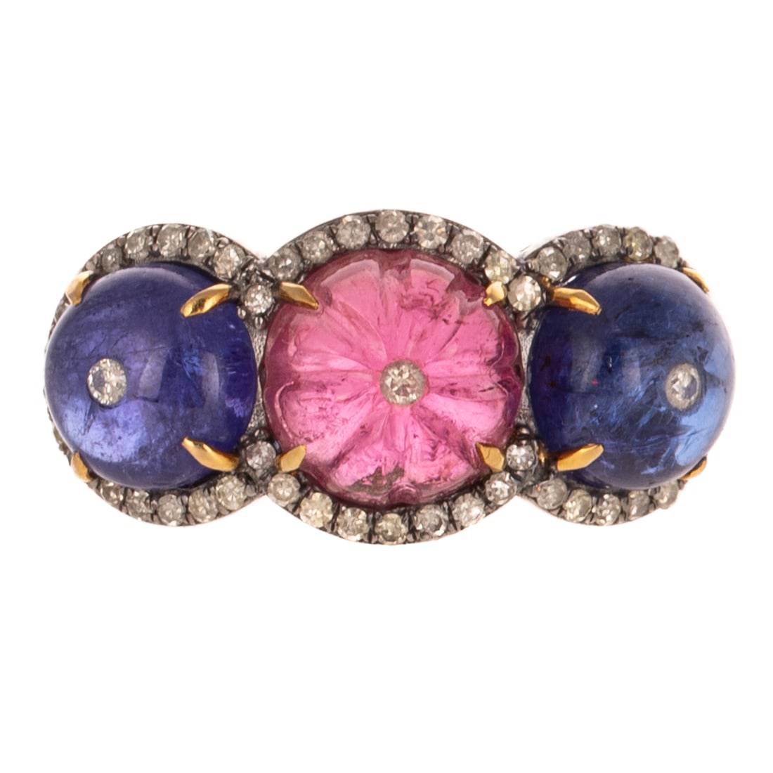 A Pink Tourmaline, Tanzanite & Diamond Ring in Sterling Silver: Sterling silver ring featuring a carved pink tourmaline cabochon weighing approx. 3.90 carats prong set flanked by two tanzanite cabochons weighing approx. 7.20 ctw prong set, each cabochon topped wit