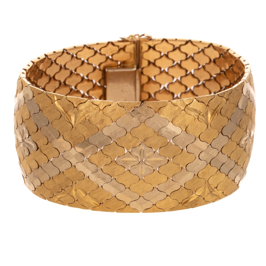 A Two Tone Interlocking Panel Design Bracelet in 18K: 18K yellow and white gold bracelet, made in Italy, with a smooth flexible interlocking panel design featuring engraved flower designs in center of each rhombus shape design, 1 1/4 in. W, 7 3/4 in. L, 