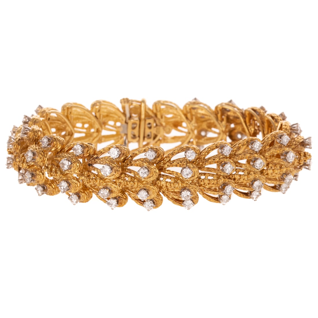 A 4.15 ctw Diamond Textured Bracelet in 18K: c.1970s, 18K yellow gold textured leaf link bracelet featuring well matched round diamonds weighing approx. 4.15 ctw with an average color grade of G - H and an average clarity grade of VS2 - SI1, hid