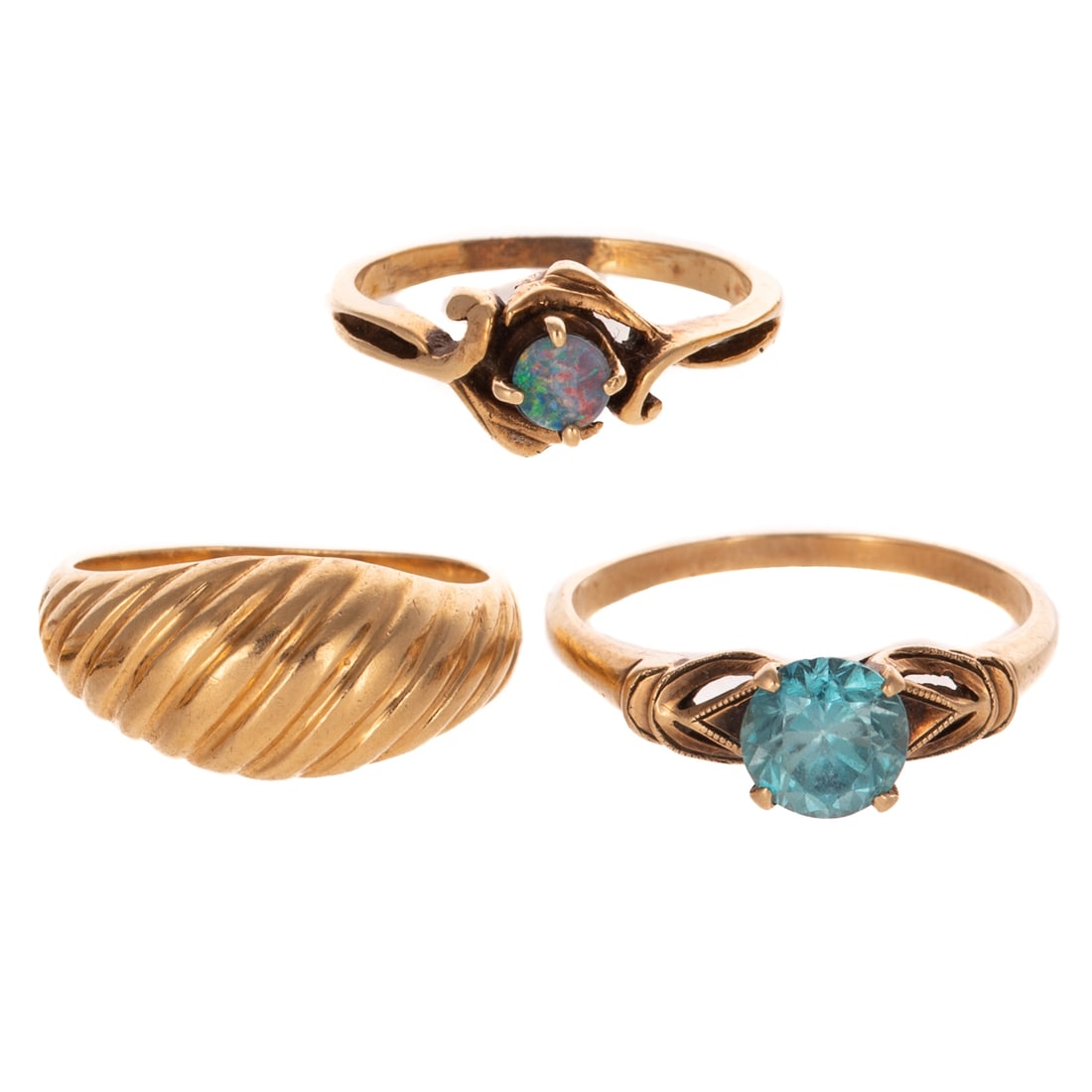 A Trio of Gemstone Rings in 14K & 10K: 1) 14K yellow gold ring featuring a round opal doublet 3.75 mm, prong set in scrolling foliage, split shank, sz 4, 2) 14K yellow gold dome ring with fluted design, sz 4.25, and 3) 10K yellow gold ring