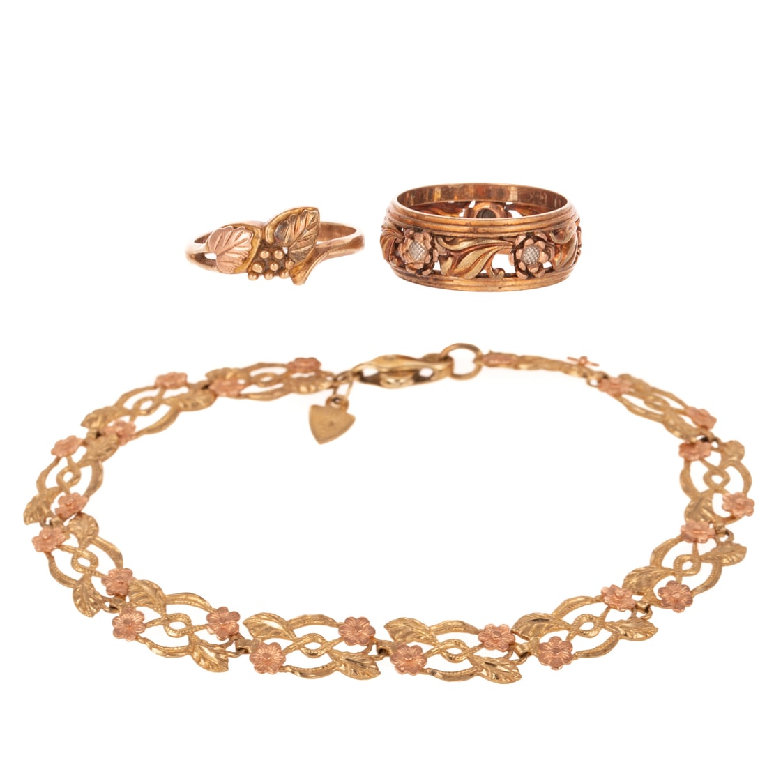A Trio of Rose, Yellow & White Gold Jewelry in Gold: 1) 14K yellow and rose gold filigree link bracelet with foliage and blossoms, lobster clasp, 7 in. L, 2) 14K tri-color gold filigree band with foliage and blossoms, sz 6.5, and 3) 10K yellow and rose