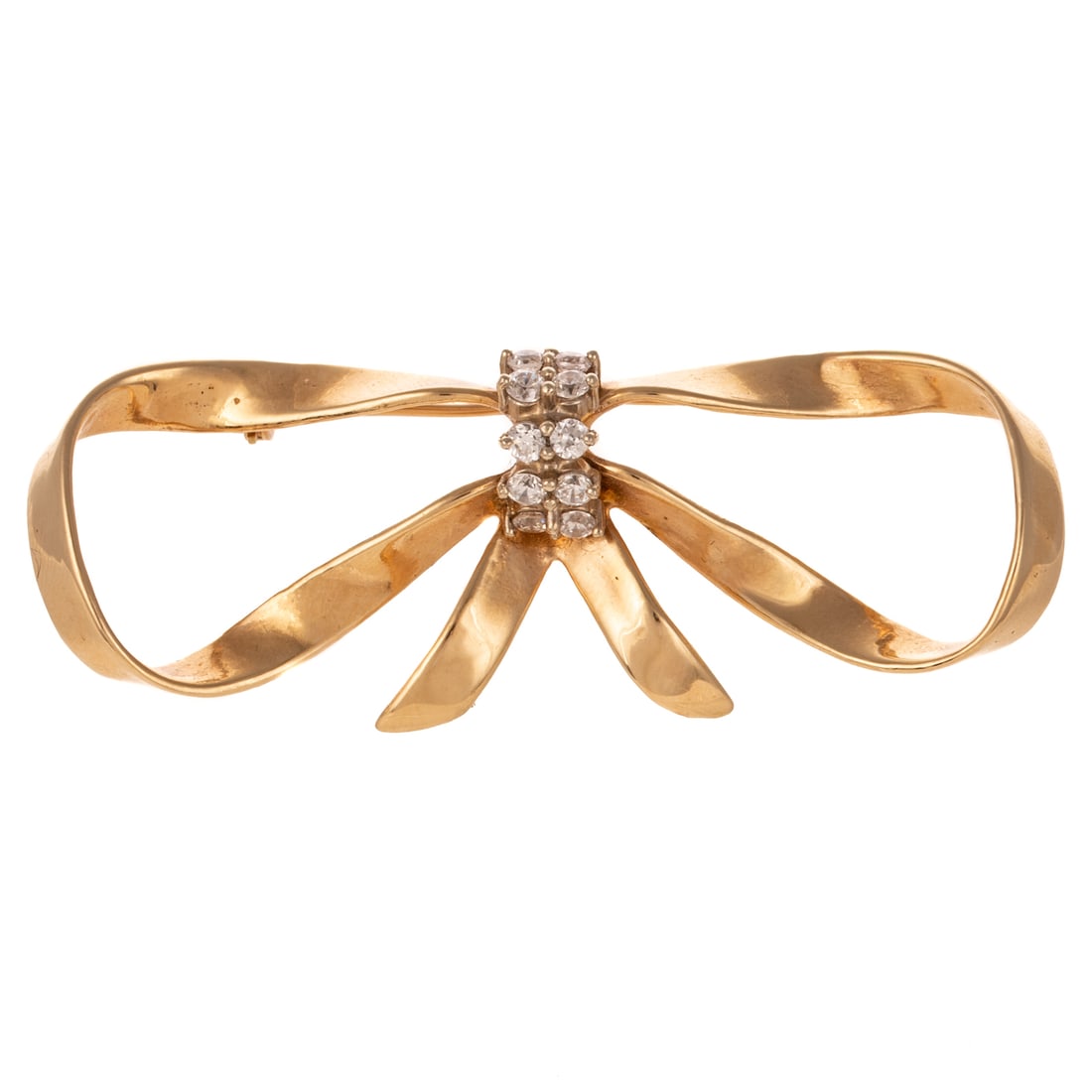 A Ribbon Bow Brooch in 14K: 14K yellow gold by Stuller featuring 10 round CZs shared prong sent down center of high polish bow, 2 1/4 in. W, signed, 9.7 grams