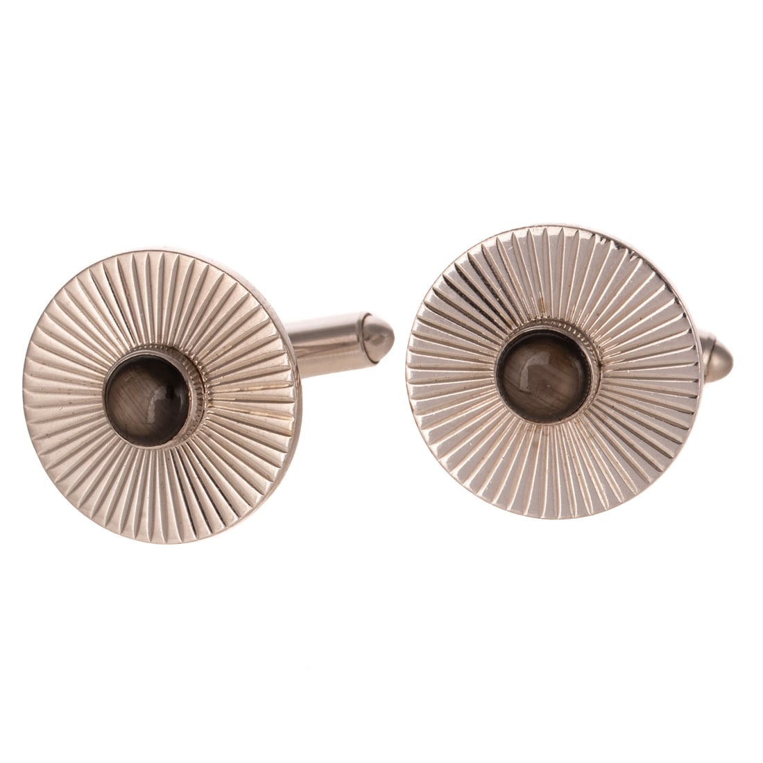 A Pair of Black Star Sapphire Cufflinks in 14K: 14K white gold cufflinks featuring round bezel set black star sapphire in the center of an engraved starburst design, swivel bar clasp, 3/4 in. W, 14.8 grams