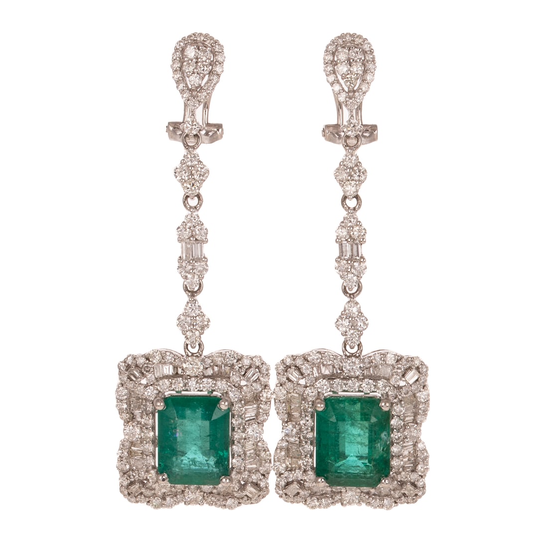 A Pair of Emerald & Diamond Dangle Earrings in 14K: 14K white gold earrings by Orianne featuring a pair of well matched emerald cut emeralds weighing approx. 9.58 ctw prong set in individual frames of round and baguette diamonds prong set dangling belo