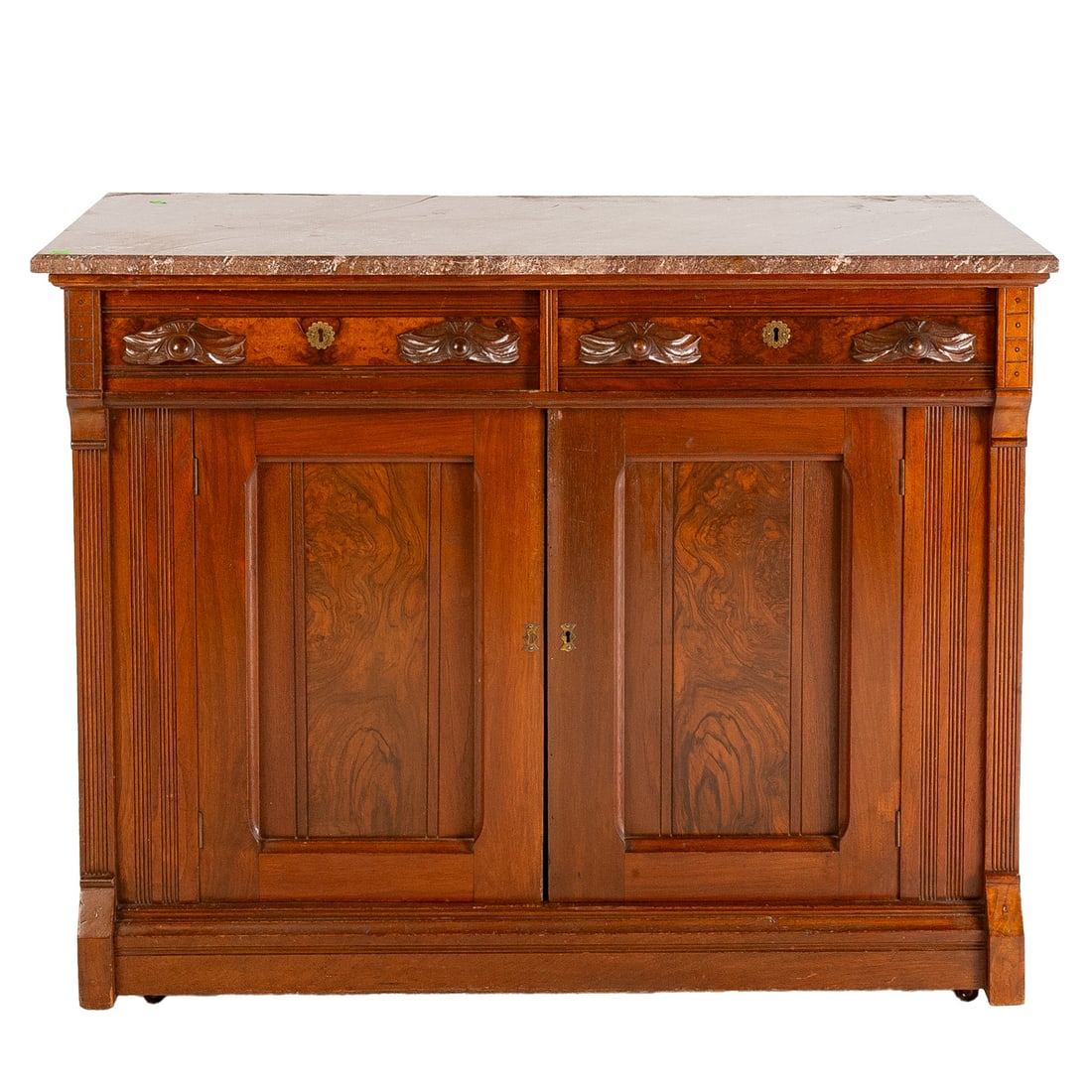 Victorian Walnut Marble Top Server: Chamfered marble top resting on a carved walnut two drawer, two door castered base, 38 in. H, 48 in. W, 22 in. D