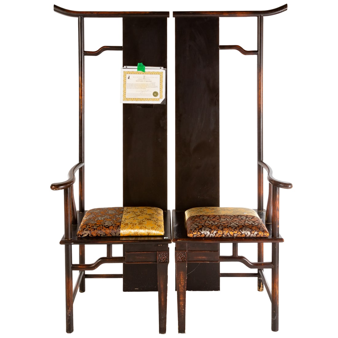 A Pair of Chinese Elmwood Highback Chairs: 20th century, a pair of pendant high back chairs with loose upholstered cushions, each: 71 in. H, 24 in. W, 22 in. D Provenance: Belrose Gallery certificate of appraisal attached