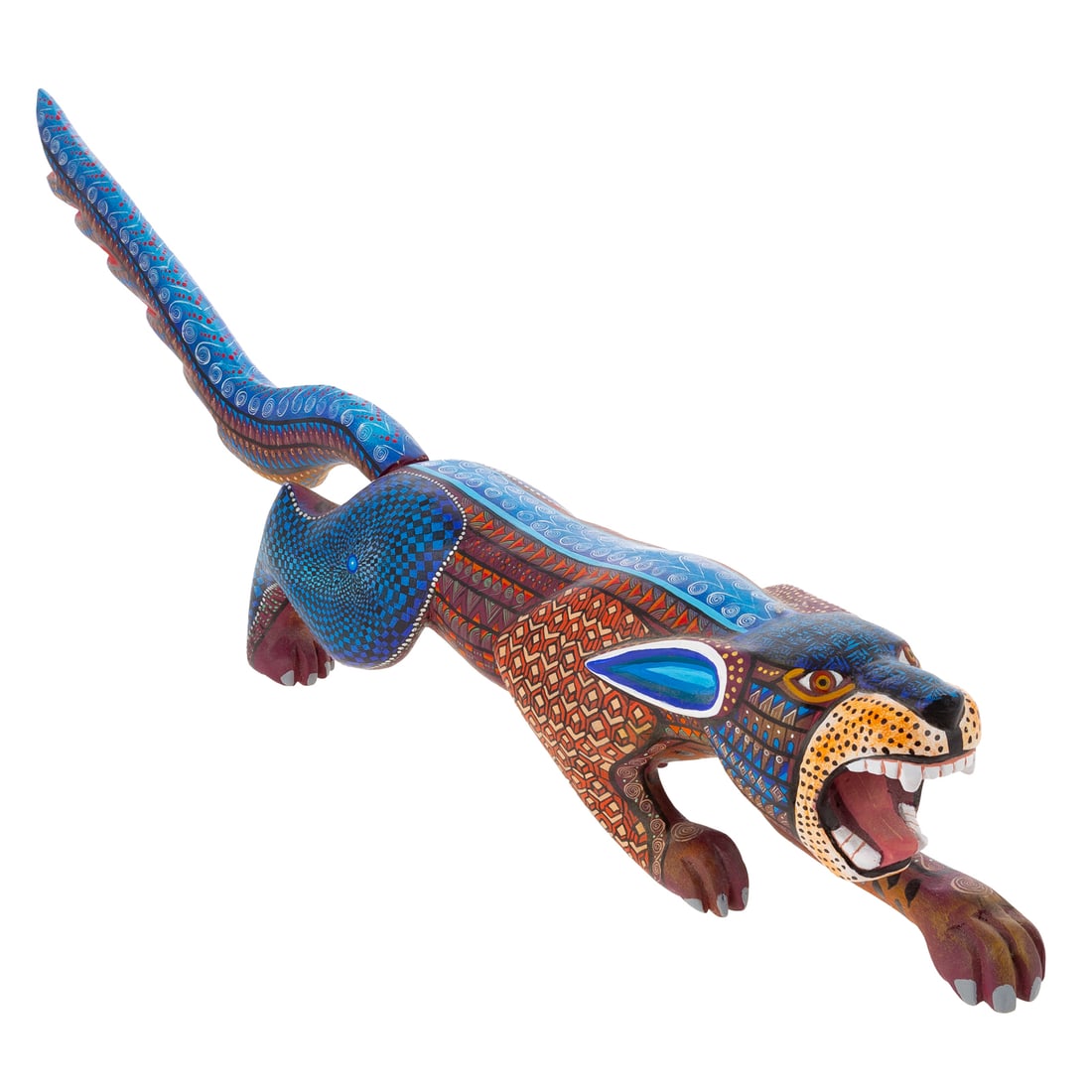 Oaxacan Alebrije Jaguar by Florencio Fuentes: (Tilcajete Oaxaca Mexico) A painted and carved wood Oaxacan Alebrije jaguar figure by Florencio Fuentes, signed and marked on the bottom, 4 1/2 in. H, approx. 24 in. L, 4 1/4 in. W
