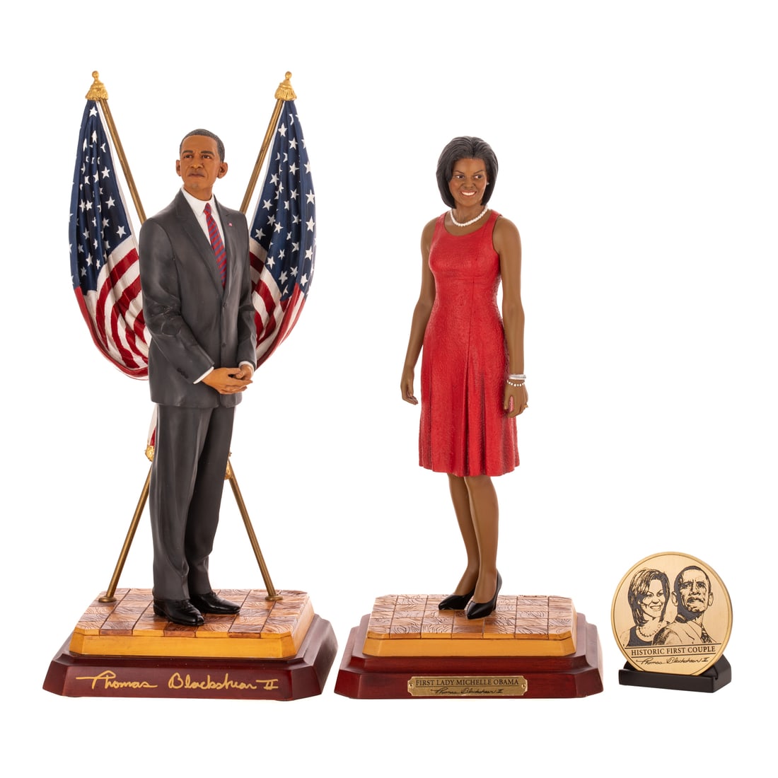 Two Thomas Blackshear's Ebony Visions by Lenox: Including a hand cast resin Thomas Blackshear's "First Lady Michelle Obama" depicting a smiling Michelle Obama with a round 2010 commemorative coin with stand, stamped, signed, includes original box