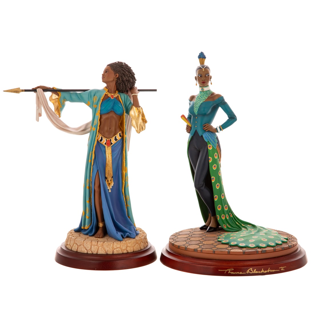 Two Thomas Blackshear's Ebony Visions by Lenox: Including a hand cast resin Thomas Blackshear's "Lady Peacock" depicting a woman standing with her hands on her hips with a peacock themed attire, stamped, signed, includes original box and COA, 13 1/