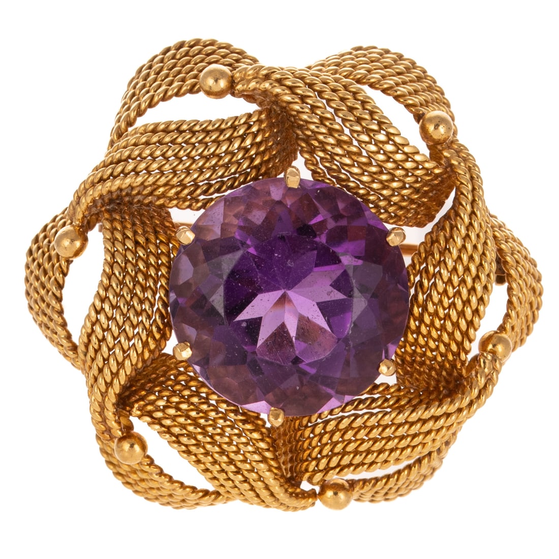 A Textured Ribbon Brooch with Amethyst in 18K: 18K yellow gold textured ribbon brooch featuring a round amethyst measuring 15.5 mm in the center, 1 1/2 in. W, 16.0 grams Provenance: From the Estate of Louis B. McCarthy, Baltimore, MD