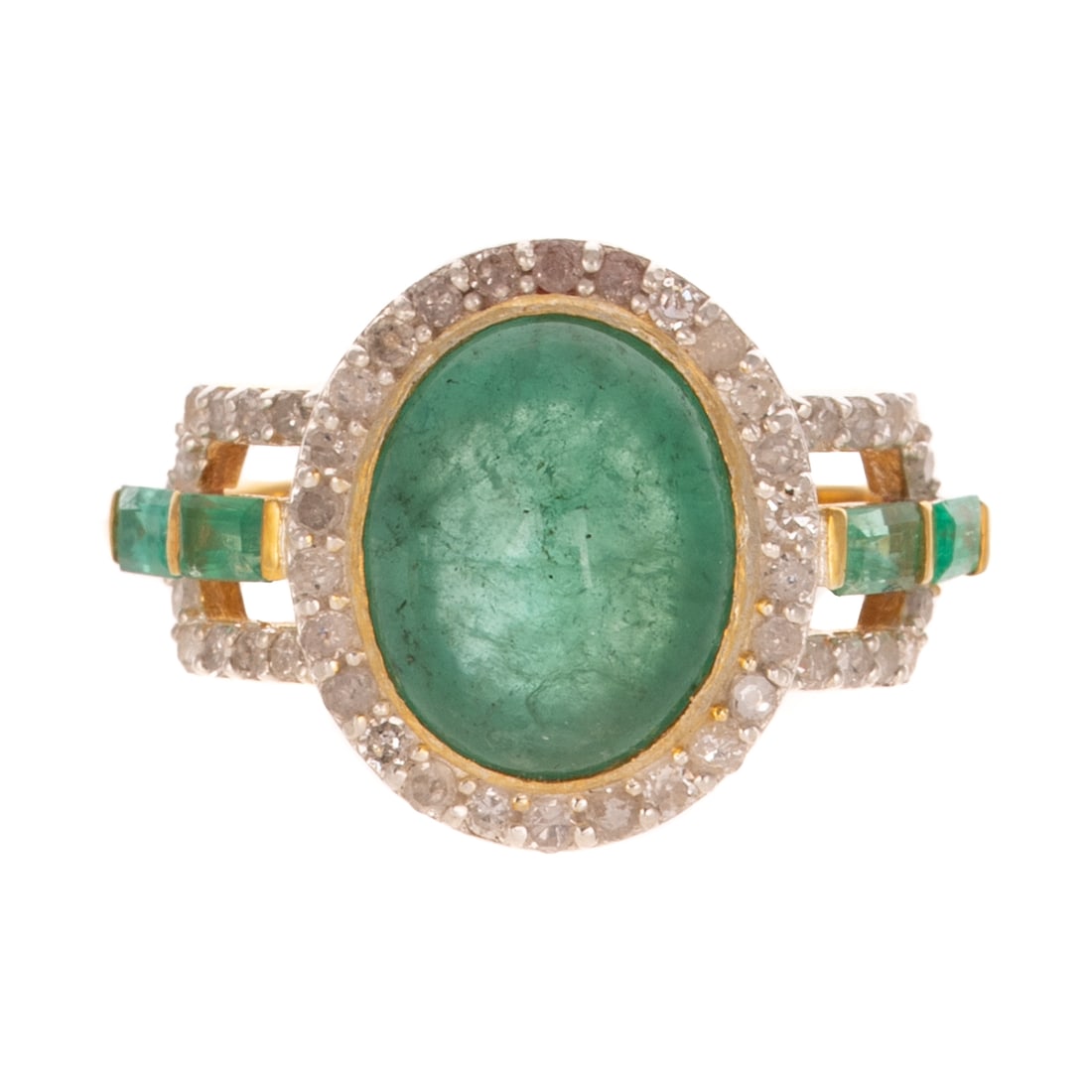 An Emerald & Diamond Cocktail Ring: Vermeil ring featuring an oval shaped emerald weighing approx. 2.85 carats bezel set in the center of a halo of round diamonds shared prong set with additional diamonds continuing onto split shank