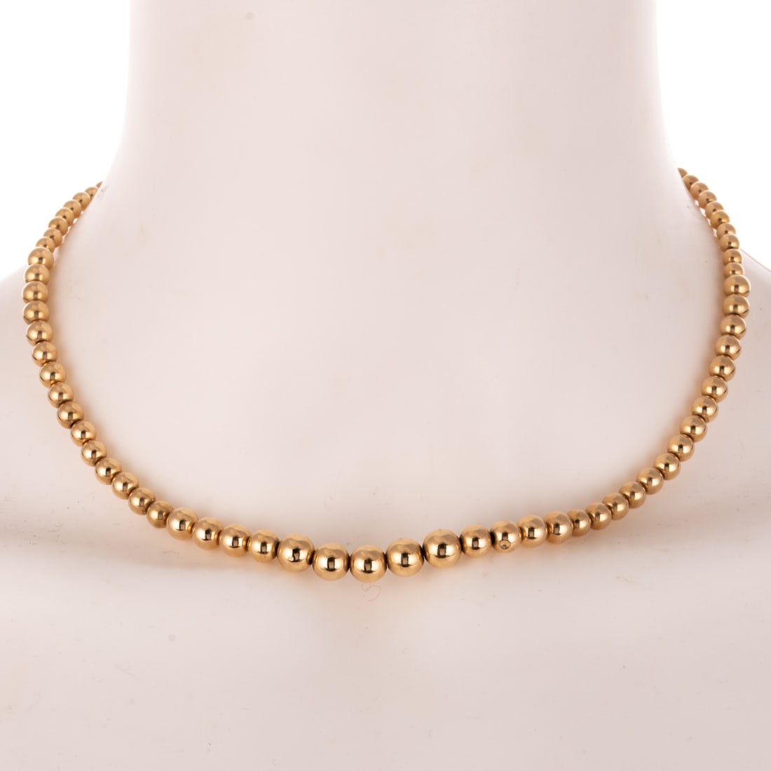 A Graduated Gold Bead Necklace in 14K: 14K yellow gold graduated gold bead necklace, 3.9 - 6.9 mm, 16 1/4 in. L, 10.0 grams