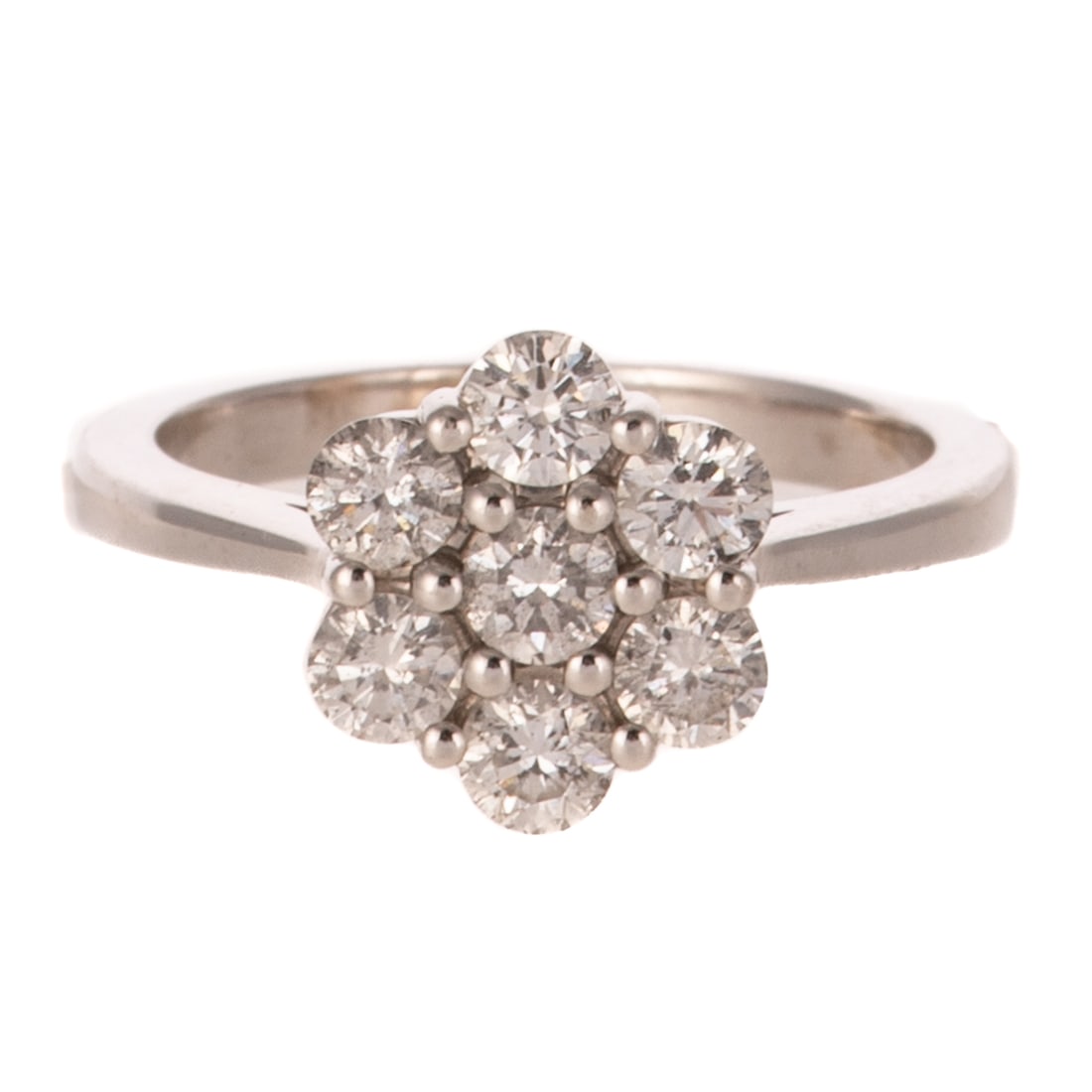A Diamond Cluster Ring in 14K: 14K white gold diamond cluster ring featuring seven round diamonds weighing approx. 1.00 ctw with an average color grade of H - I and an average clarity grade of SI2 -I1, shared prong set, sz 6, 3.7