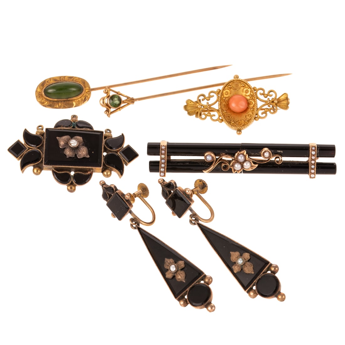 A Collection of Antique Victorian Jewelry in Gold: 1) 18K yellow gold Etruscan revival pin with filigree work and central coral cabochon, 1 1/4 in. L, 2) 14K yellow gold stick pin featuring a round green tourmaline accent bezel set, 2 1/2 in. L, 3) 10
