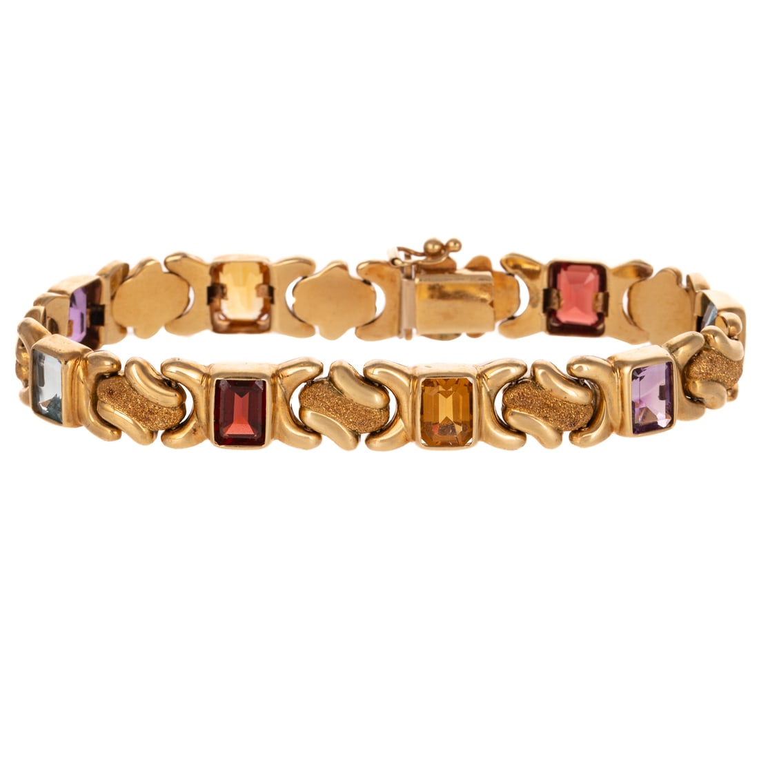 A Multi-Gemstone Bracelet in 14K: 14K yellow gold bracelet featuring emerald cut garnet, blue topaz, amethyst, and citrine, each measuring approx. 8 x 6 mm, bezel set in between knot-style stipple and high polish links, hidden box cla