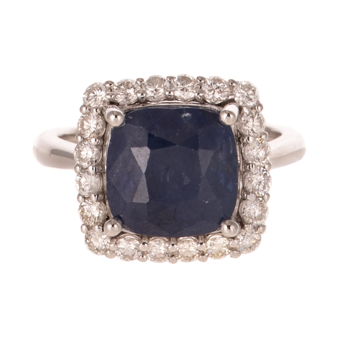 A 6.36 ct Ceylon Sapphire & Diamond Ring in Platinum: Platinum ring by Oscar Friedman featuring a cushion cut Ceylon sapphire weighing 6.36 carats, accompanied by GIA Gemological Report #2235723062, prong set in a frame of round diamonds weighing approx.