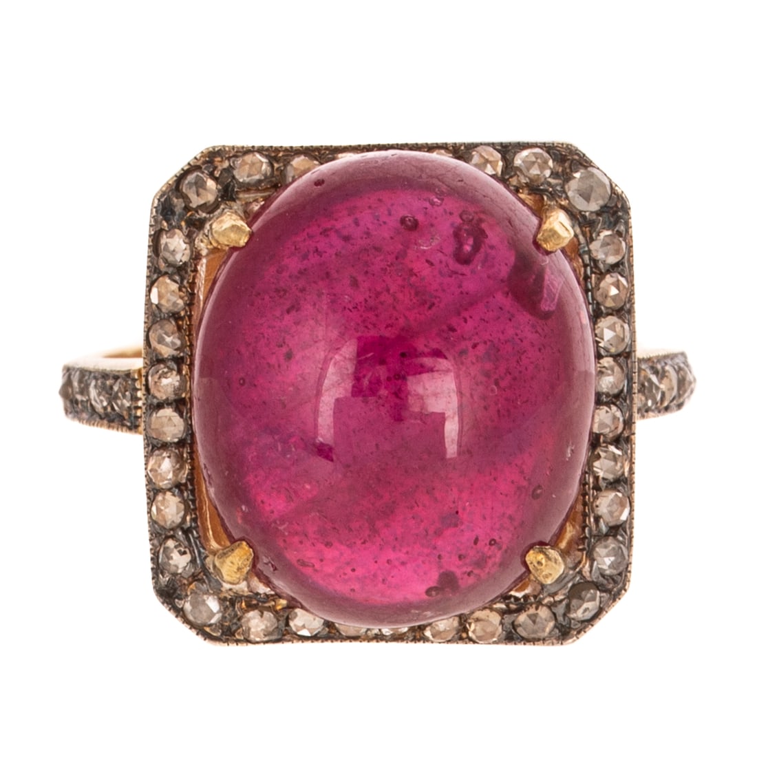 A Ruby Cabochon & Diamond Ring: Vermeil ring featuring an oval shaped ruby cabochon weighing approx. 9.00 carats prong set in the center of a rose cut diamond bead set frame with additional diamonds bead set on shank, sz 7, 5.8 gram