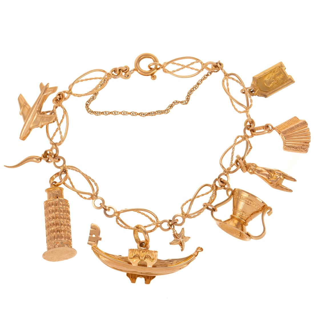 An Italian Themed Charm Bracelet in 18K: 18K yellow gold charm bracelet featuring seven 18K Italian and travel theme charms such as an airplane, Italian horn, Leaning Tower of Pisa, gondola, water pitcher, accordion, and mano cornuta,