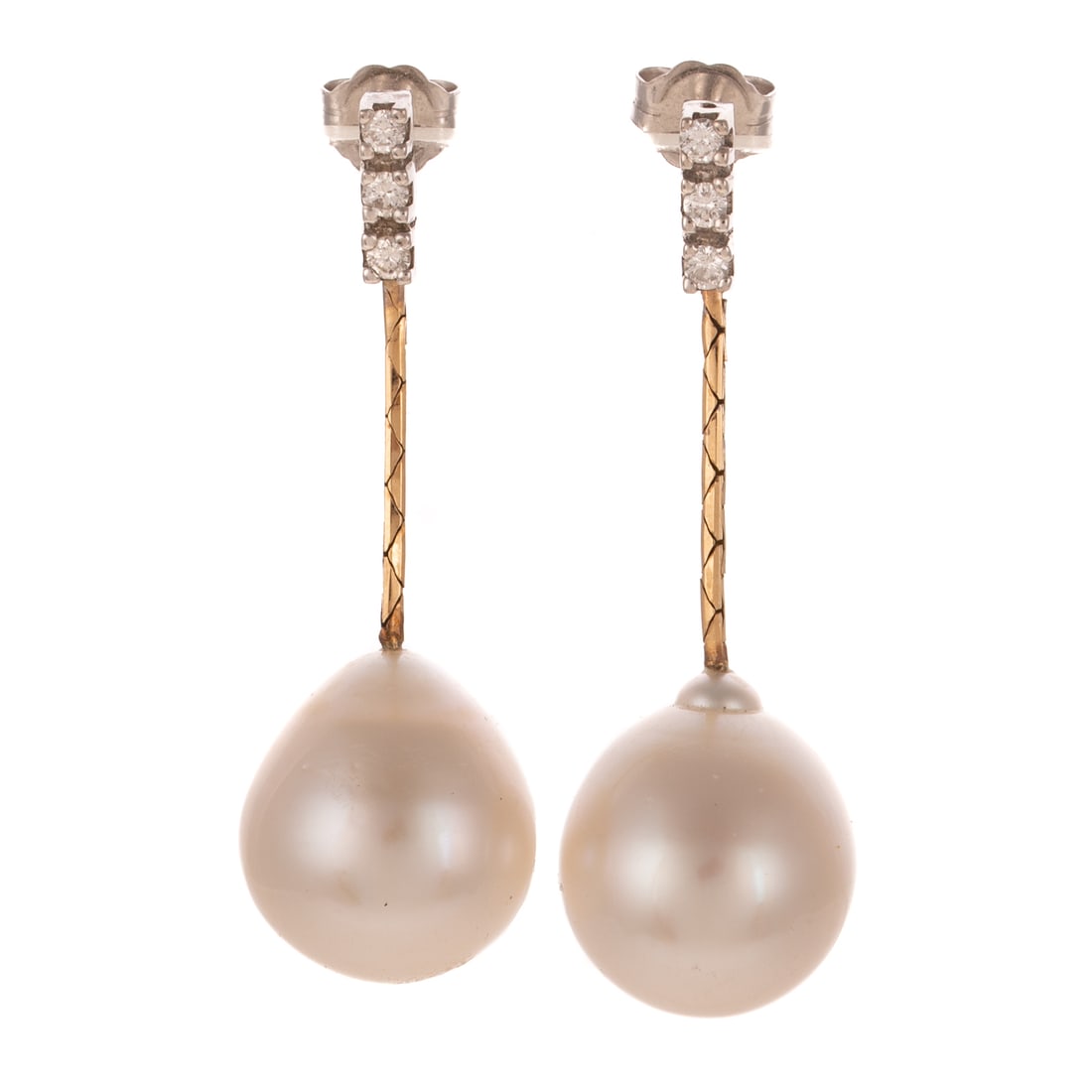 A Pair of South Sea Pearl & Diamond Dangle Earrings in 14K: 14K bi-color gold earrings featuring lines of three round diamonds weighing approx. 0.40 ctw prong set in white gold suspending 14K yellow gold cobra chains with cultured South Sea pearls measuring 14