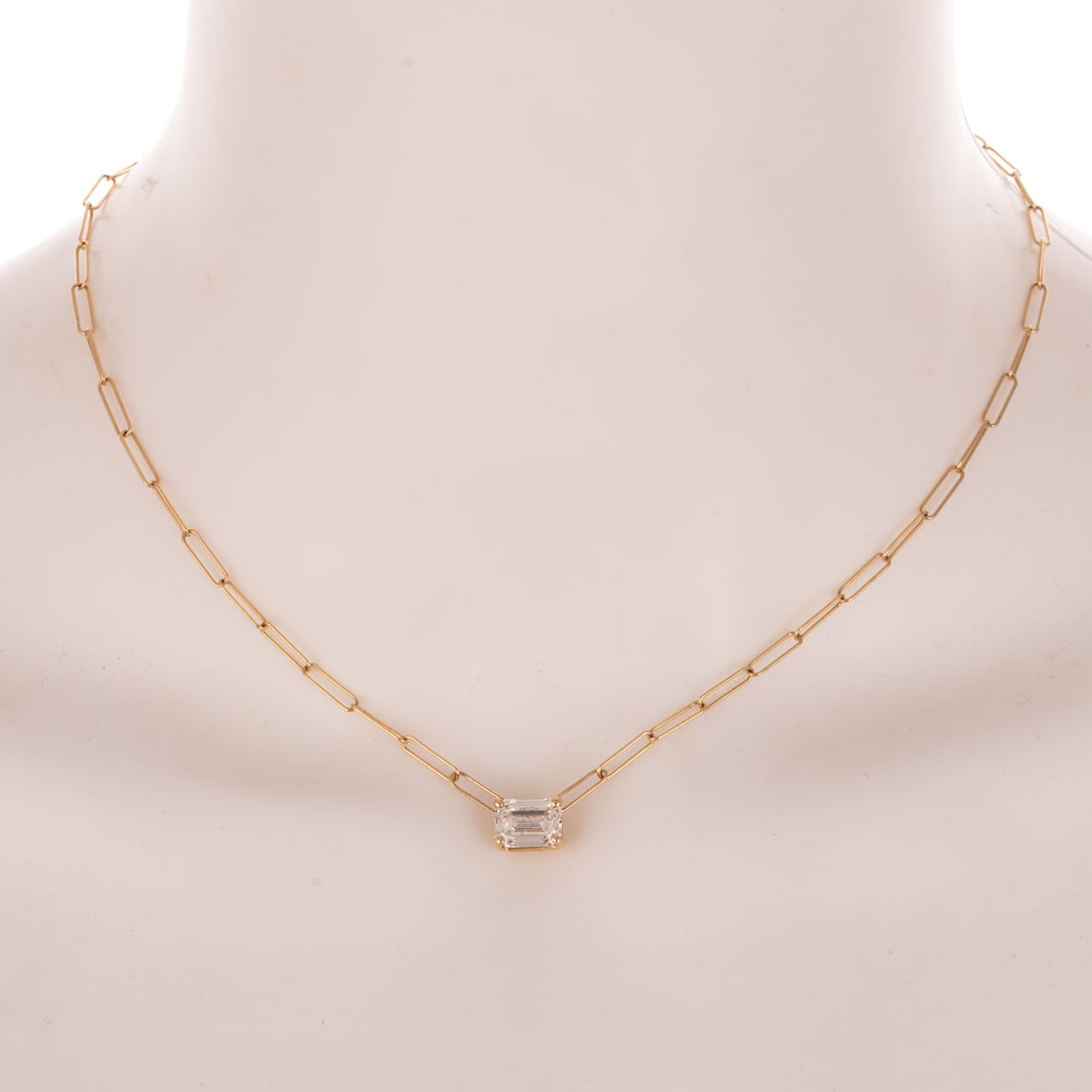 A GIA 2.07 ct Diamond Solitaire Necklace in 14K: 14K yellow gold paperclip chain necklace featuring an emerald cut diamond weighing 2.07 carats with a color grade of G and a clarity grade of SI2, accompanied by GIA Gemological Report #6335977725,