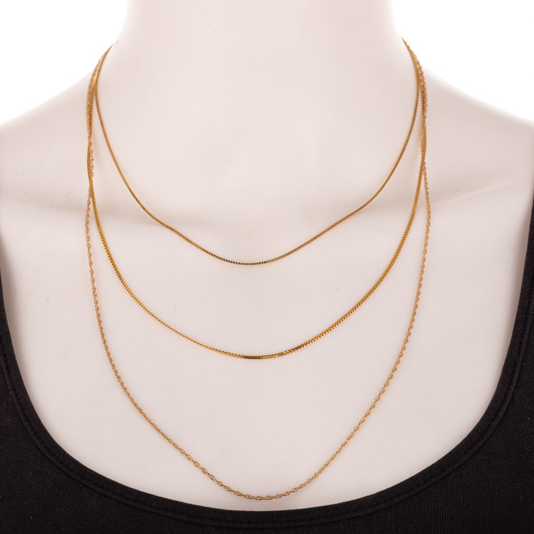 A Trio of Various Linked Chains in 14K: 1) 14K yellow gold box chain with spring ring clasp, 16 3/4 in. L, 2) 14K yellow gold twist rope chain with spring ring clasp, 24 in. L, and 3) 14K yellow gold thin herringbone chain with spring ring 