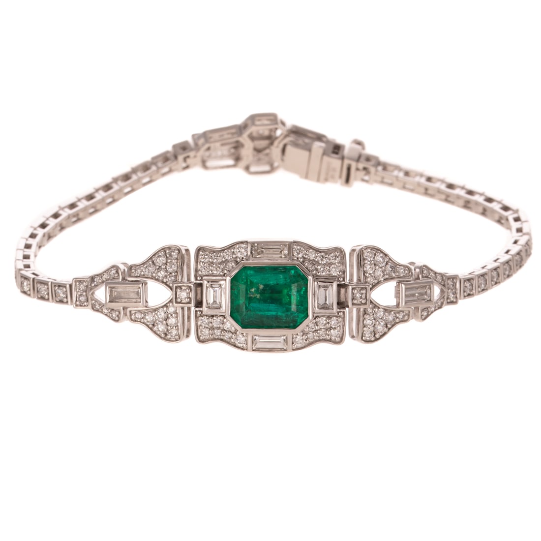 An Art Deco Style Emerald & Diamond Bracelet in Platinum: Art Deco style platinum bracelet by Oscar Friedman featuring a very fine emerald cut emerald weighing approx. 3.42 carats bezel set in a frame of round diamonds bead set and baguette diamonds bezel se