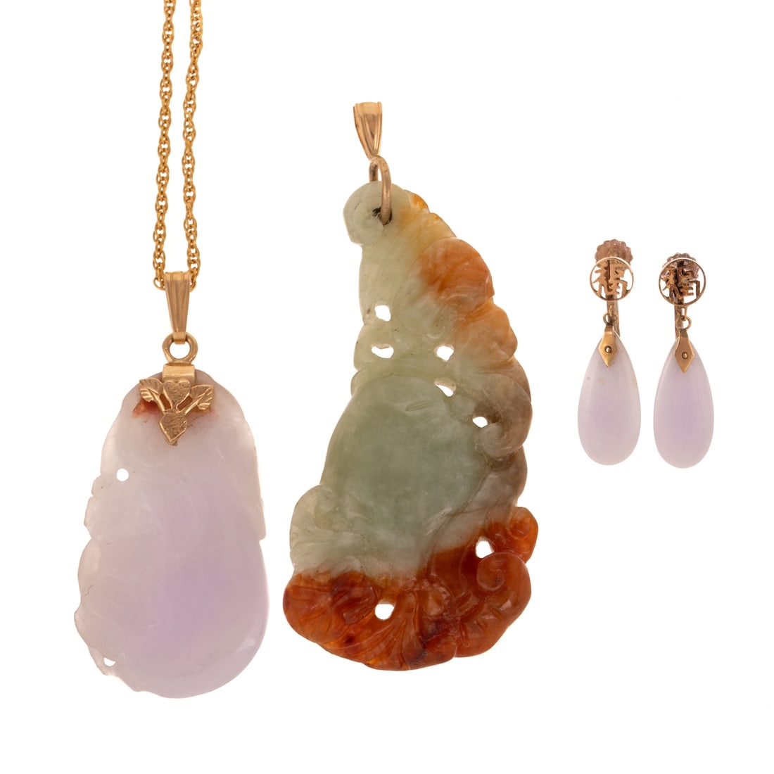 Two Fine Carved Jade Pendants & Earrings: 1) 14K yellow gold carved fine lavender jade pendant depicting floral design, hanging on a rope chain with spring ring clasp, 20 in. L, 2) Gilt ear clips featuring a tear drop lavender jade, and 3) 14