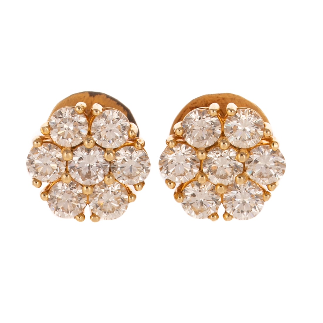 A Pair of 3.00 ctw Diamond Cluster Studs in 18K: 18K yellow gold studs featuring clusters of seven round diamonds shared prong set weighing approx. 3.00 ctw with an average color grade of G - H and an average clarity grade of VS - SI, threaded posts