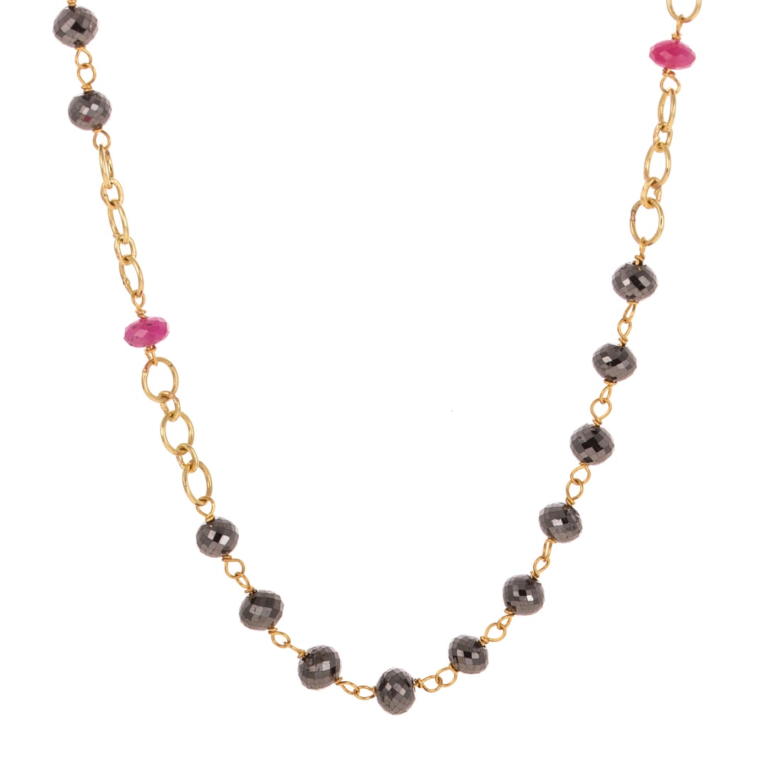 A Black Diamond & Ruby Necklace in 14K: 14K yellow gold cable link rosary-style necklace with black diamond station beads weighing approx. 40.00 ctw with ruby bead accents weighing approx. 4.50 ctw, with ruby and black diamond bead tassel i