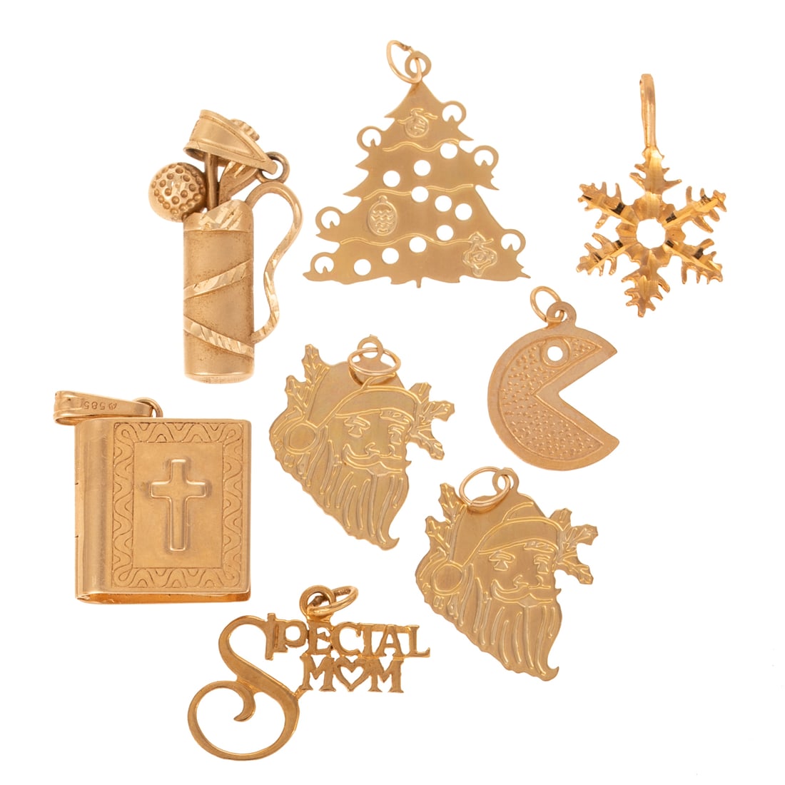 A Collection of Christmas Themed Charms in 14K: Eight 14K yellow gold charms including Holy Bible with list of written books inside, golf clubs, PacMan head, Christmas tree, two Santa heads, and more, 6.6 grams tw