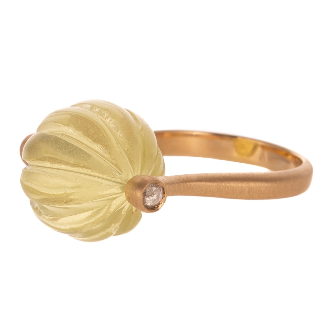 A Lemon Quartz Roller Ring in 18K: 18K yellow gold ring featuring a carved spinning lemon quartz bead weighing approx. 17.75 carats set on a bar with round diamonds bezel set on either end, brushed finish shank, sz 7, 7.0 grams