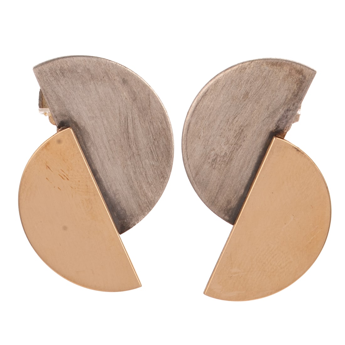 A Pair of Two Toned Betty Cooke Pinwheel Earrings: 14K yellow gold and sterling silver pinwheel earrings by Betty Cooke (1924 - 2024), Baltimore, MD, featuring a high polish 14K semi-circle and sterling silver brushed semi-circle, posts with large fat