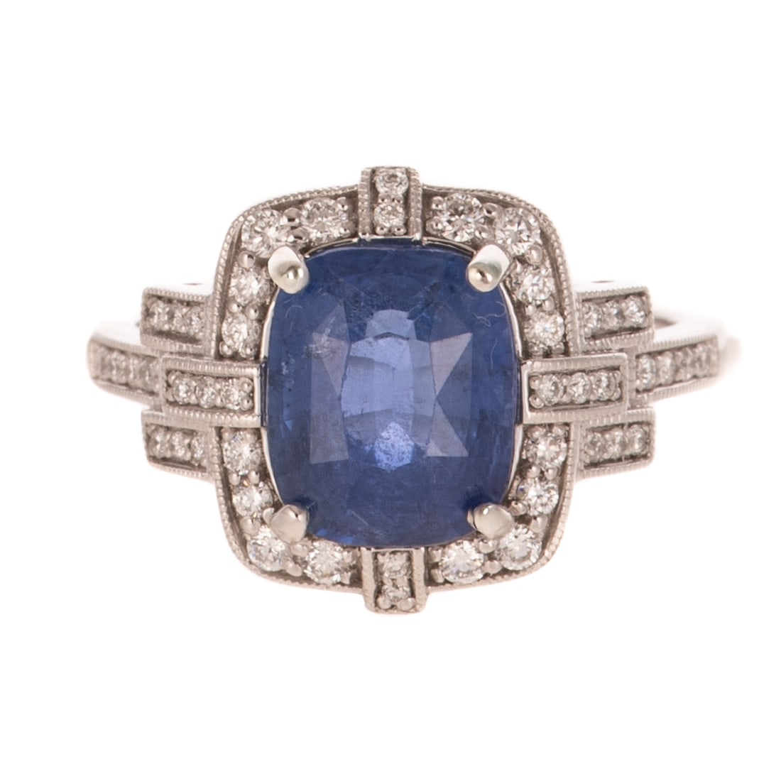A GIA 3.66 ct Sapphire Ring in Platinum: Platinum ring by Otto Gofflieb featuring a cushion cut sapphire weighing 3.66 carats, accompanied by GIA Gemological Report #1232596972, prong set in the center of a round diamond prong set frame with