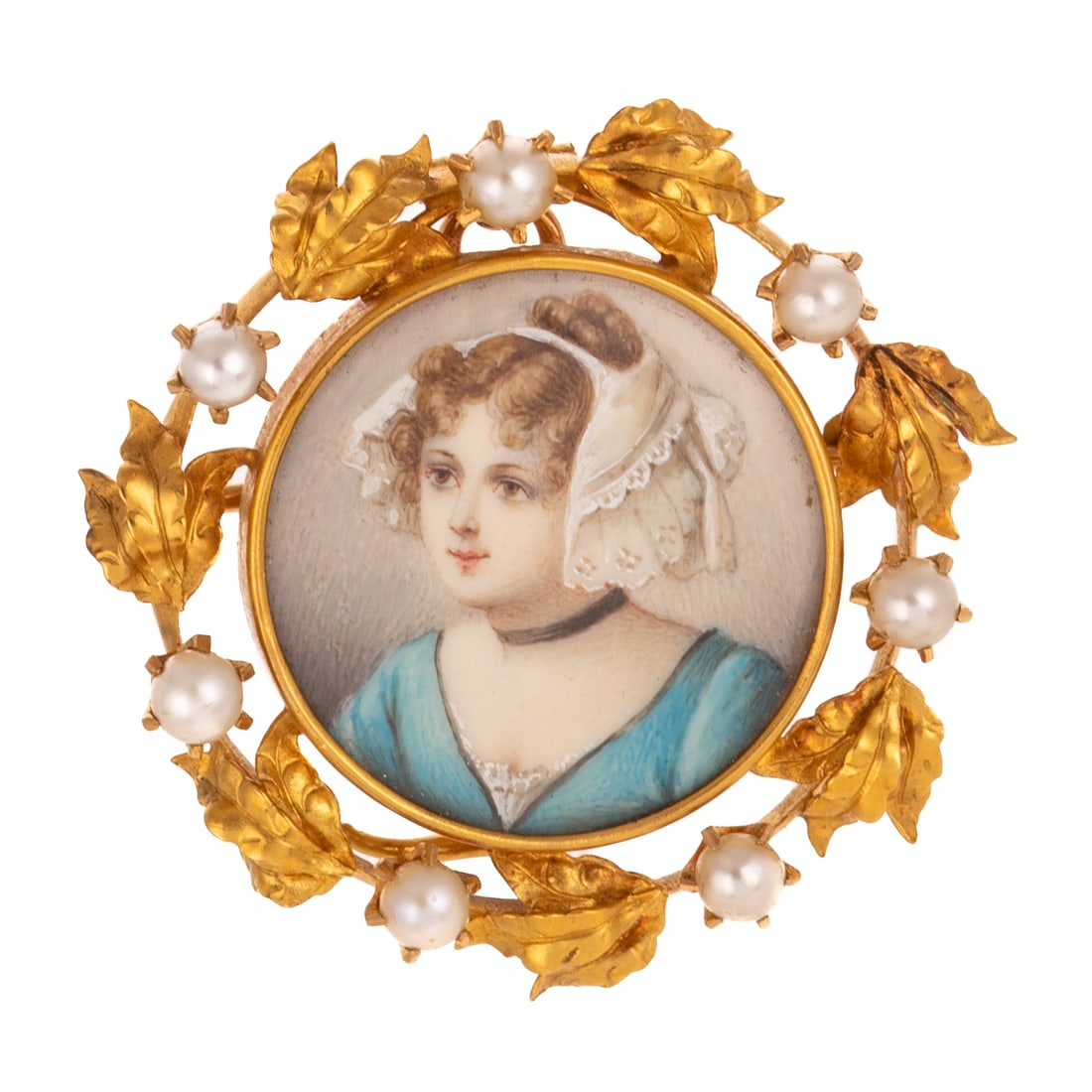 A Victorian Miniature Portrait Pin/Pendant in 14K: c.1895, 14K yellow gold portrait pin/pendant featuring hand painted portrait of a woman with alternating leaf and 3.25 mm pearl frame, back engraved in script "FBB from EJB Dec. 25, 1985", 1 3/8 in.