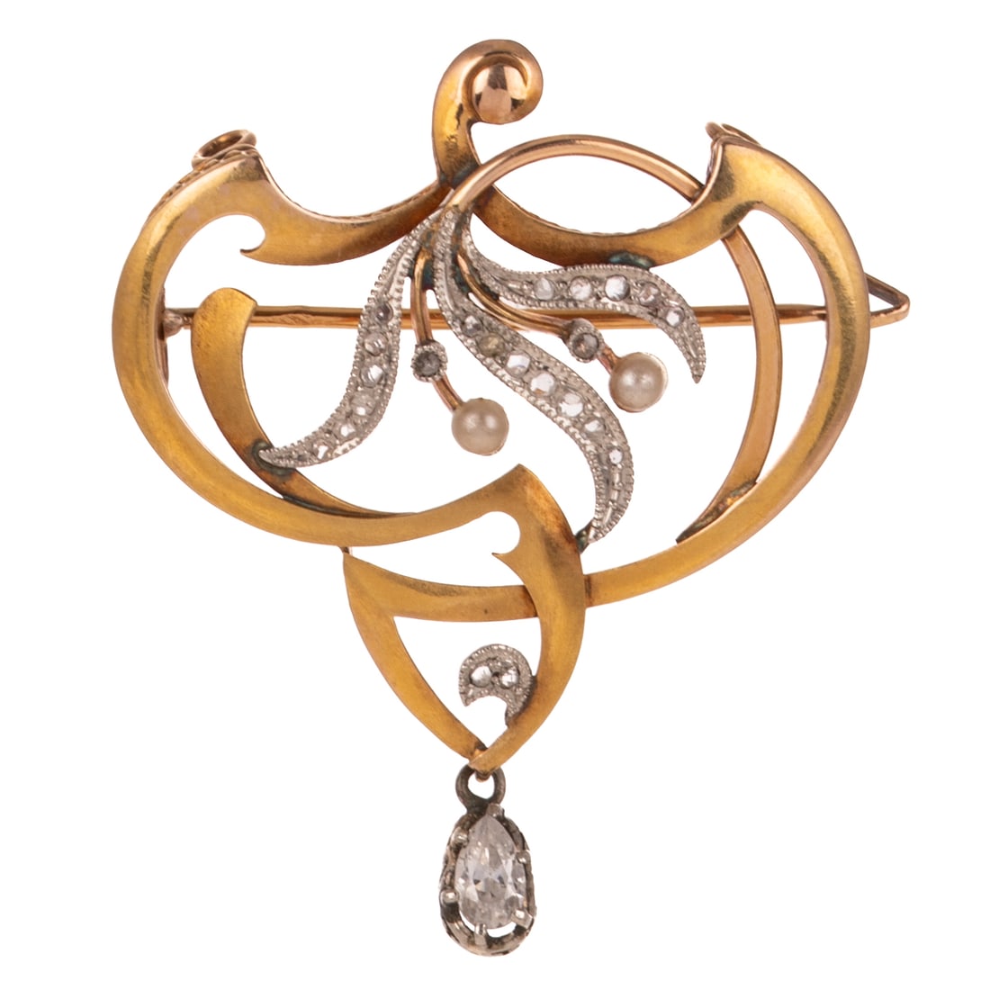 An Art Nouveau Pin/Pendant in 14K: Art Nouveau 14K yellow gold pin/pendant in a flowing openwork design with white gold tendrils with rough diamonds bead set accented by seed pearls and milgrain details, pear shape diamond weighing app
