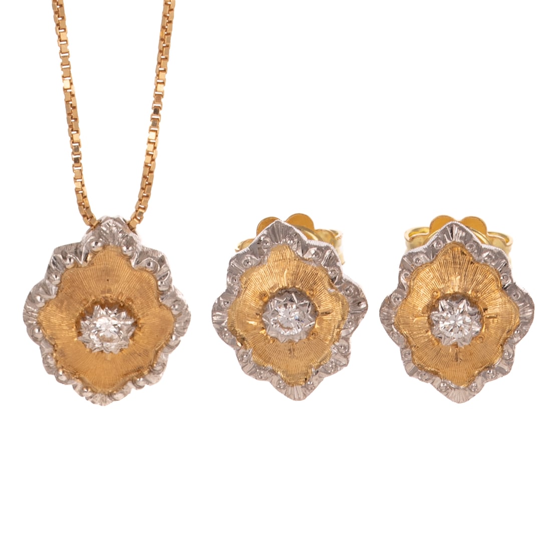 A Bi-Color Rhomboidal Diamond Set in 18K: 18K yellow gold studs in a scalloped rhomboidal shape featuring round diamonds set in a white gold star with engraved design radiating outward, framed in white gold with bead and engraved details, pos