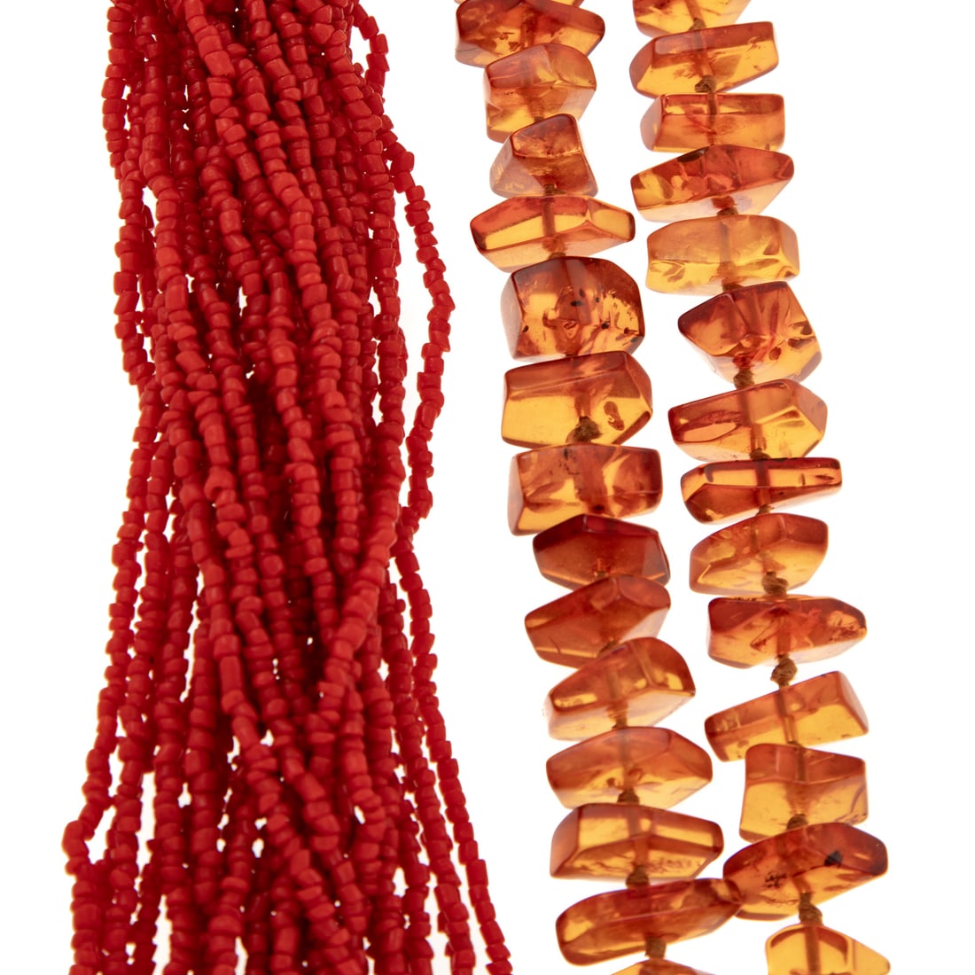 A Multi Strand Coral Necklace & Amber Necklace: 1) Thirty strand coral necklace with beads in the back and hook clasp, beads measuring approx. 2 mm each, 30 in. L, and 2) Strand of freeform amber beads strung with knots in between each bead, no cla