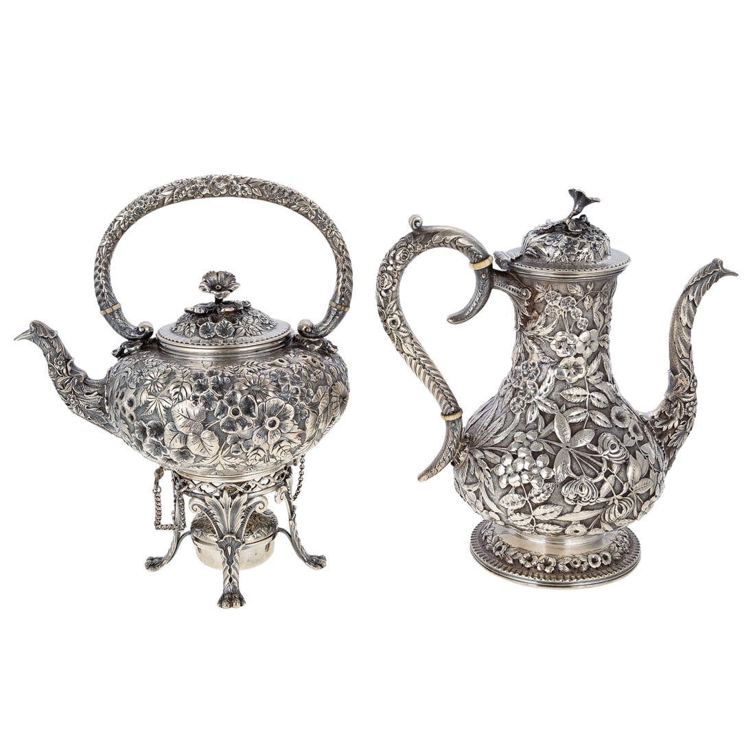 S Kirk & Son Sterling Repousse Coffee Pot & Kettle: 1896-1924, two pieces including a coffee pot and tea kettle on stand, each finely modeled in high relief with repousse decoration of trailing flowers and foliage, against a stippled ground, the coffee
