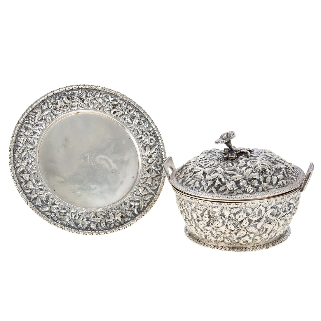 S Kirk & Son Coin Silver Butter Dish & Undertray: 1890-1896, the circular dish with gently flaring sides, the interior with insert, the cover with floral finial, decorated throughout with finely modeled high relief repousse decoration of various