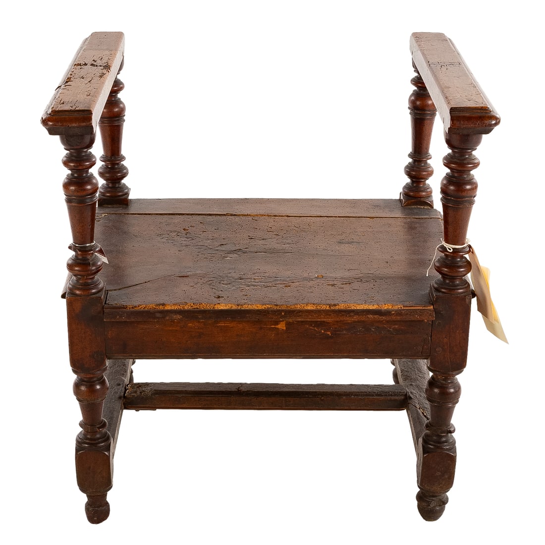 Louis XIII Walnut Low Chair, Without a Back: First half, 17th century, molded arms over turned supports, plank seat above turned and stretchered legs, 26 3/4 in. H, 25 in. W, 20 1/2 in. D Provenance: Provenance available upon request