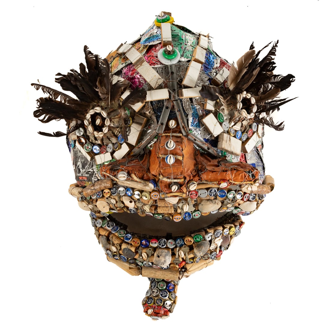 Noah Williams. Mask, mixed media wall sculpture: (American, 20th century) Wall mount, found object mask comprised of metal, keys, bottle caps, wire, wood, paint and more, signed "Noah Williams" on plate on verso, approximately 42 in. H, 30 in. W, 16