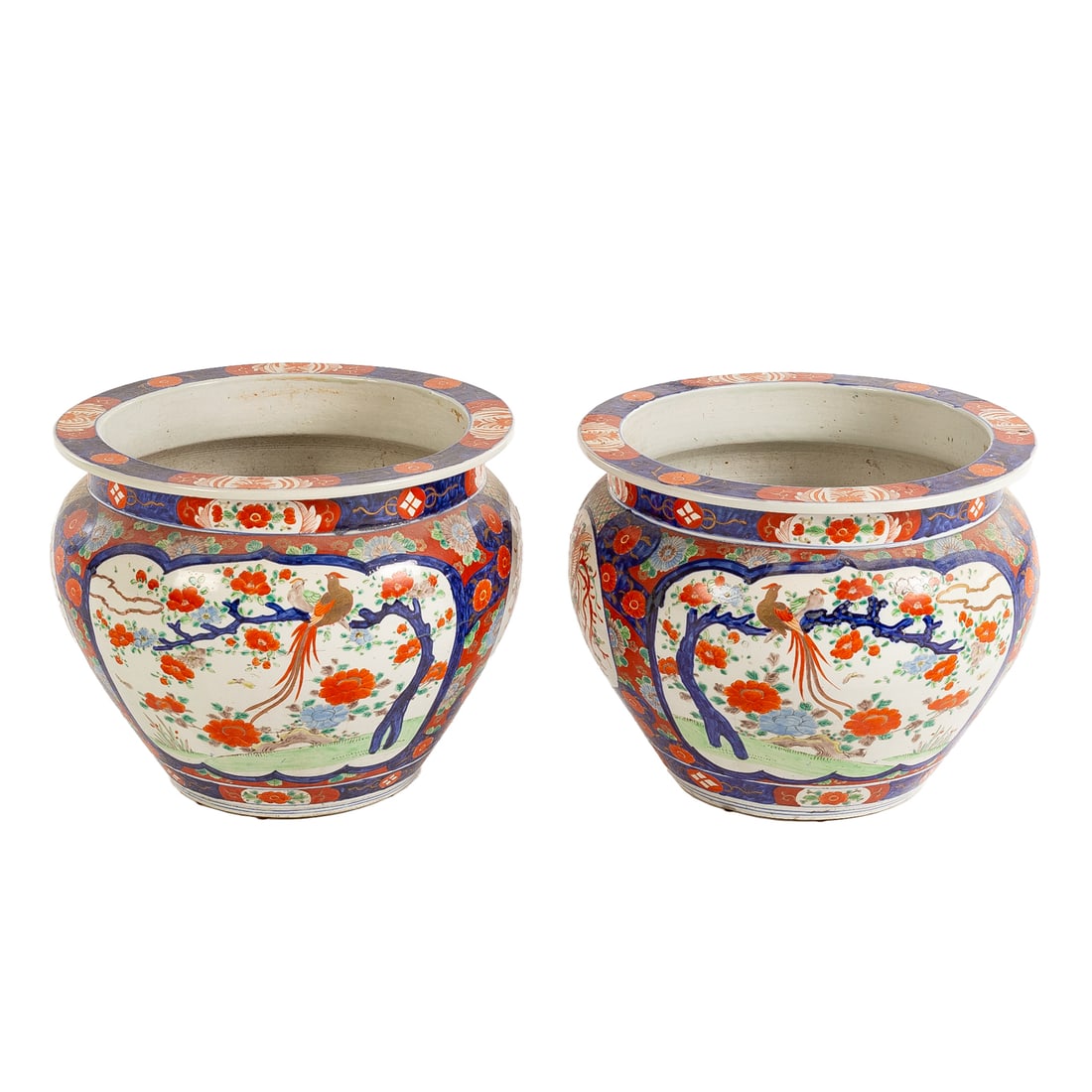 Near Pair of Japanese Imari Porcelain Jardinieres: 19th century, a near pair of Japanese Imari porcelain jardinieres depicting birds and floral motifs, unmarked, 14 3/4 in. H, approx. 18 3/4 in. Diam.