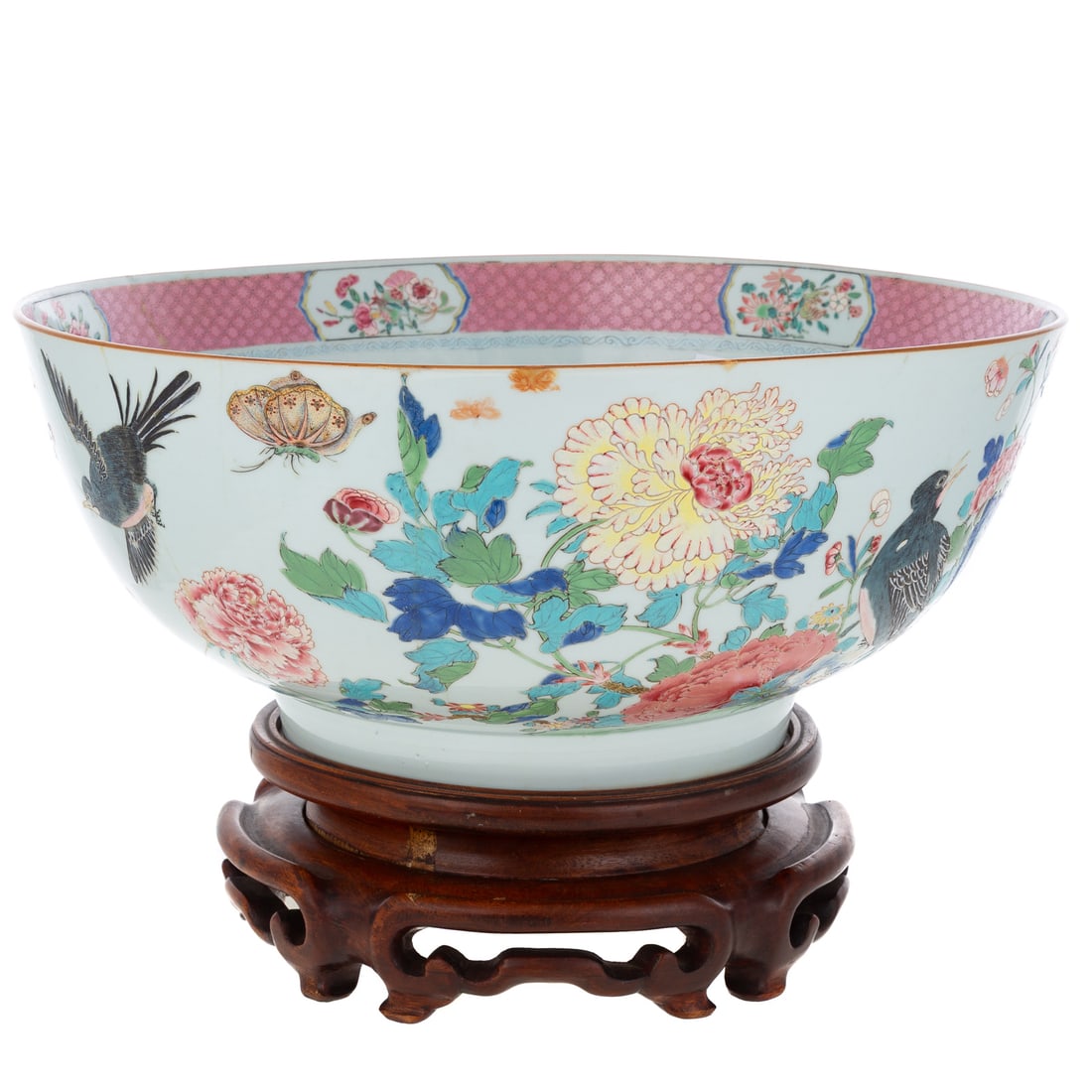 18th Century Chinese Export Porcelain Punch Bowl: Qianlong, circa 1735, a Chinese Export porcelain Famille Rose punch bowl depicting birds, flowers and butterflies, 6 3/4 in. H, 15 1/2 in. Diam. Provenance: From the Estate of Valerie Cochran.